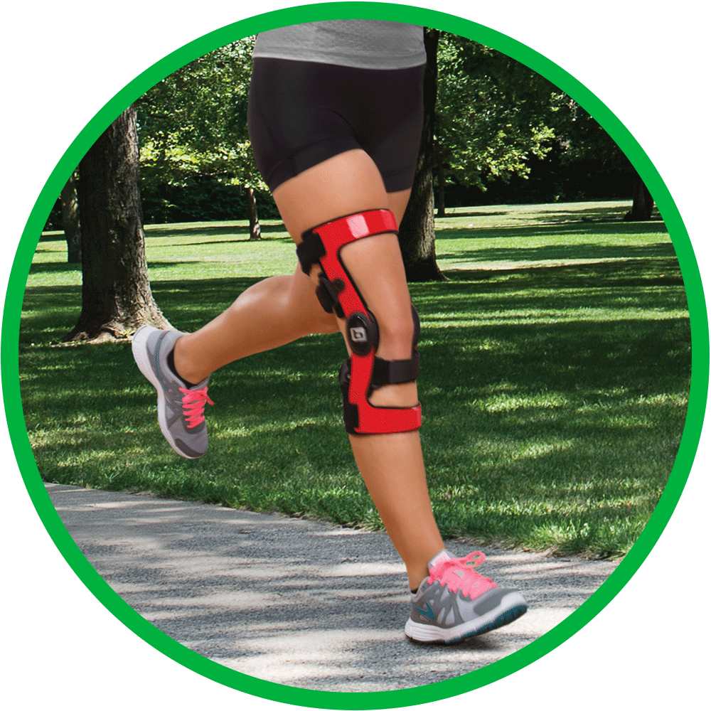 Female runner in park wears a Z-12 D Knee Brace