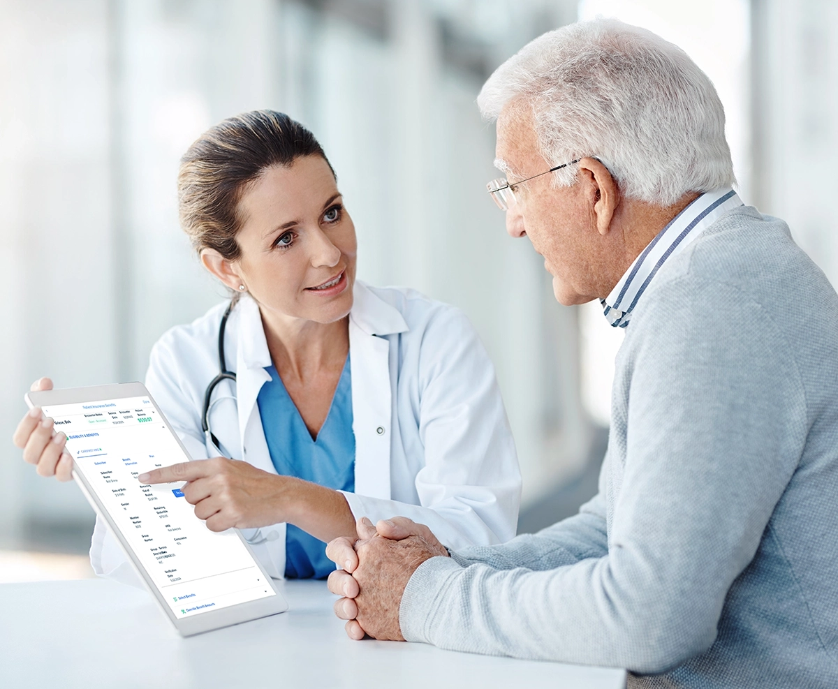 doctor displays Clarity report on a tablet to an elderly man